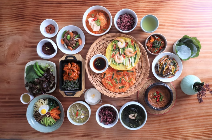 Travelers shopping for vegetables and Korean ingredients during an OME Cooking Lab market tour in Seoul